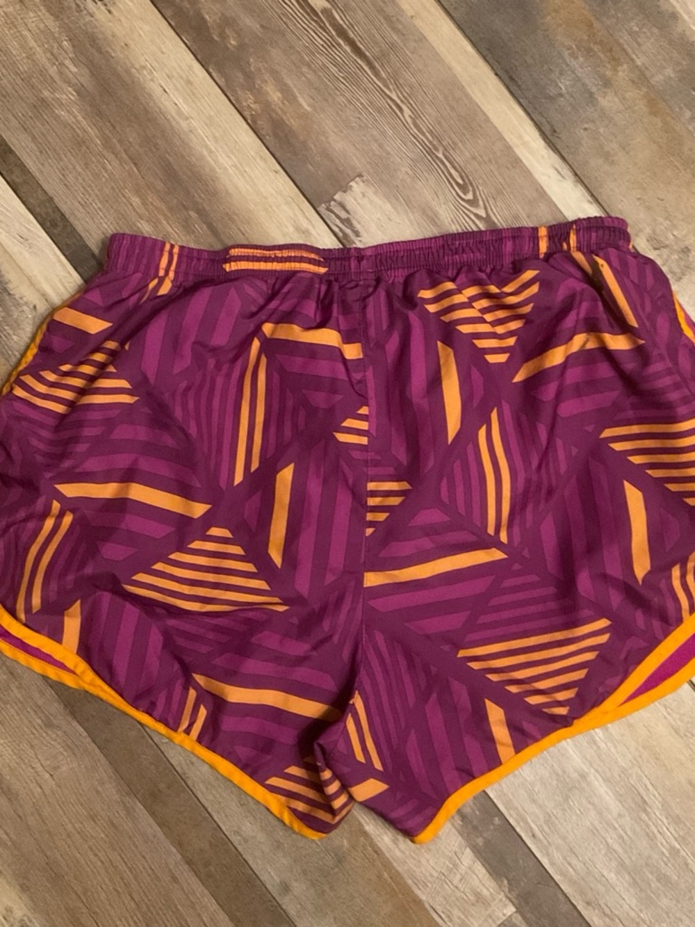 Nike Women's Purple Athletic Shorts with Orange Trim